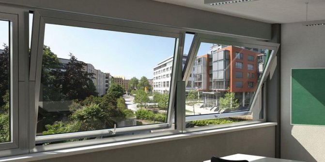 Photo: châssis à guillotine, pivotant autour d'un axe horizontal