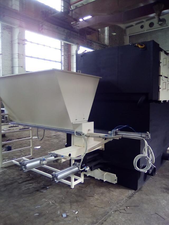 Alimentation en sciure automatique