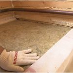 Pose de laine minérale au sol